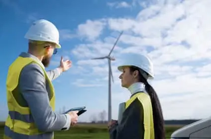 Technician diagnosing a hybrid solar inverter fault with a multimeter